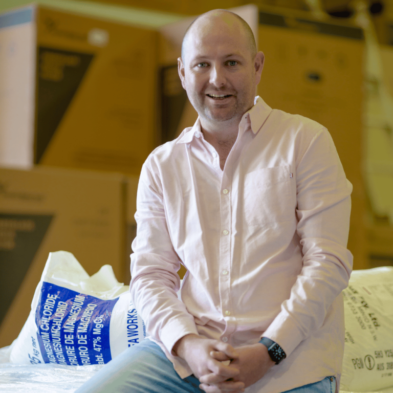 TP24 executive in a warehouse, representing the company's fintech expansion and partnership with Barclays.