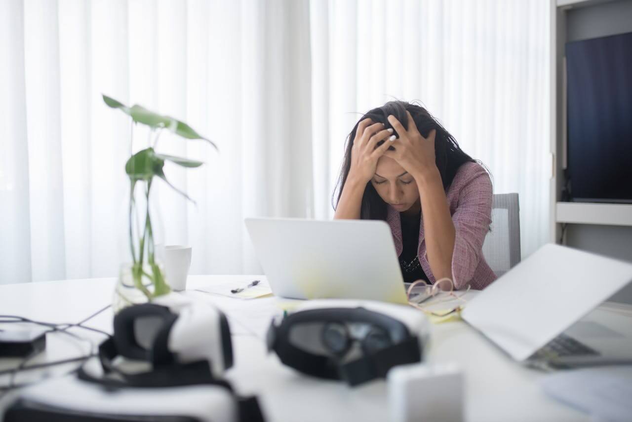 Employees reviewing payroll compliance details in an office setting